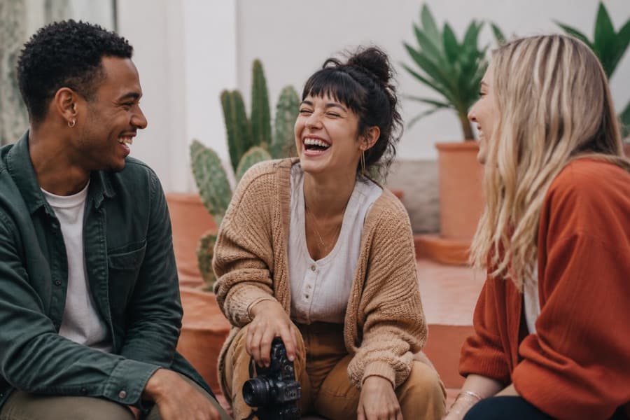 Creators laughing together outdoors
